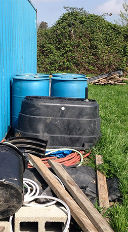 Plastic buckets and barrels at Vibrant Valley Farm