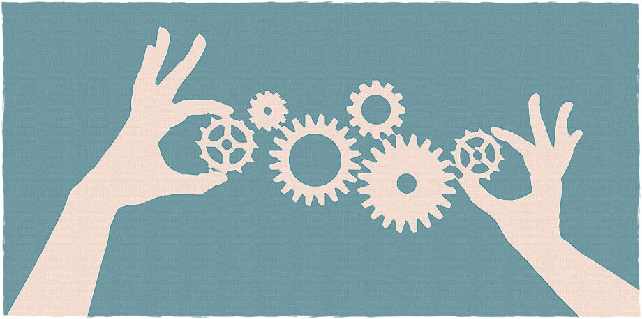 Hands aligning cogs and gears