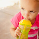 Girl with sippy cup