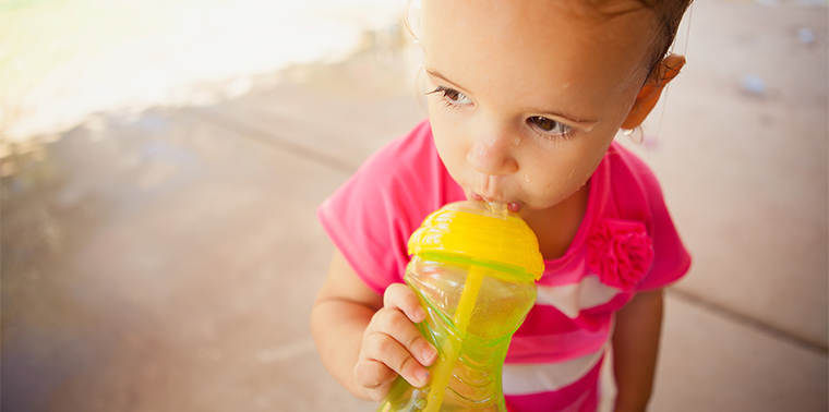 Girl with sippy cup