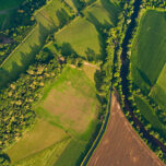 Aerial view of farm fields and houses
