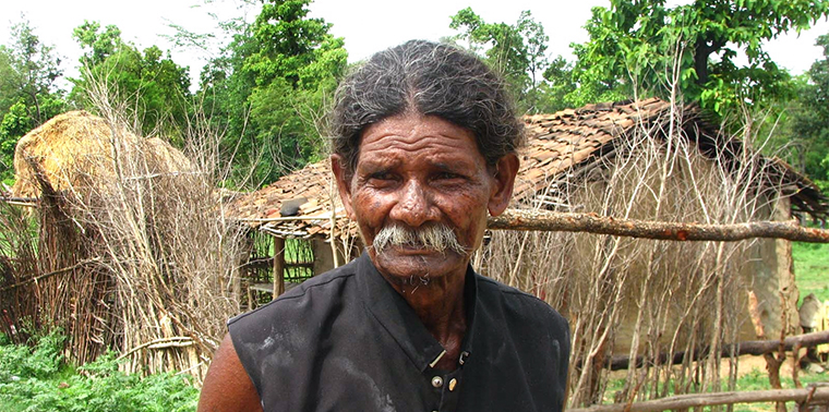 Village elder narrating his tales of woe