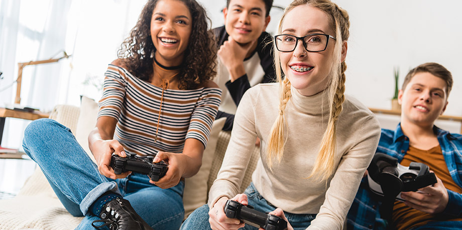 Photo of teenagers playing video games