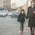 woman are going to work.she wears N95 mask.prevent PM2.5 dust and smog, mother and child wearing a mask to protect their child from air pollution and infectious diseases