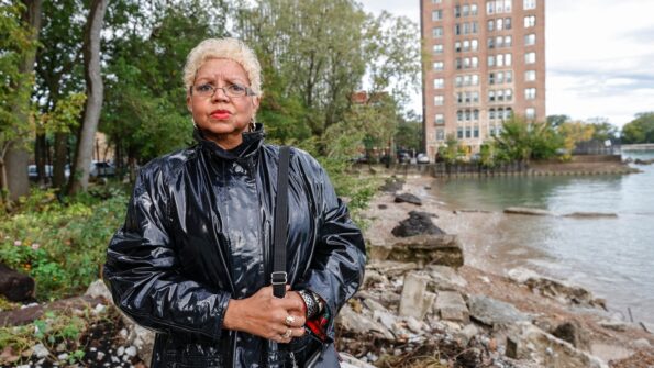 Jera Slaughter stands outside her high-rise apartment building impacted by erosion from Lake Michigan on October 14, 2021, in Chicago, Illinois.