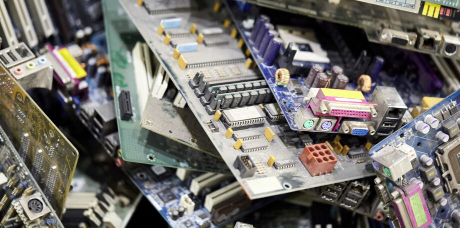 Close-up of a heap of electronic and computer hardware waste for recycling.